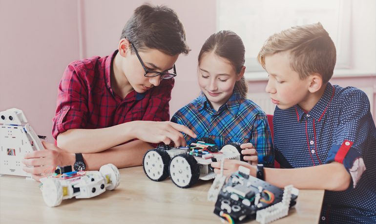 Children creating robots at school stem education